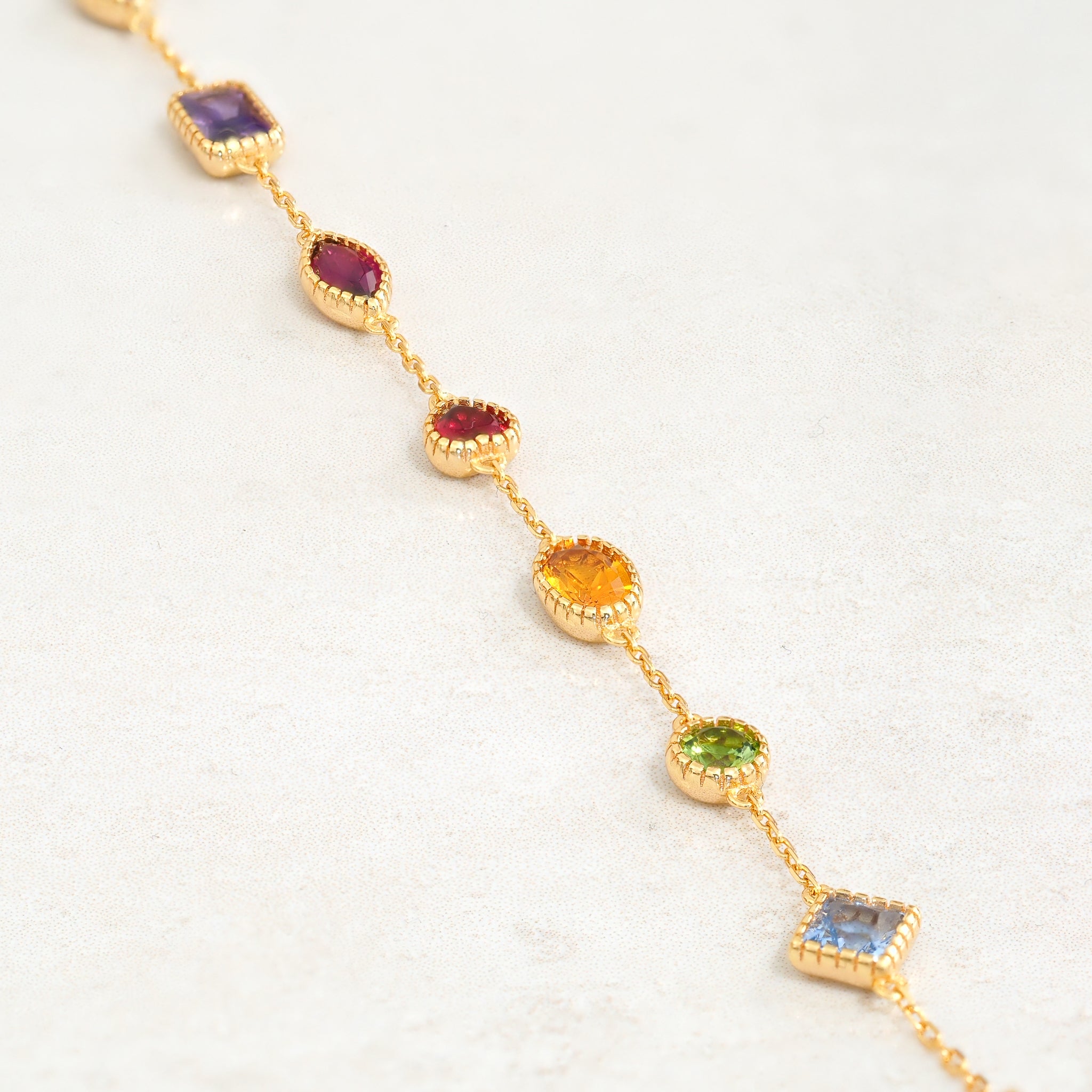 rainbow bracelet with gemstones featuring colours from the rainbow pride flag, stiraight line