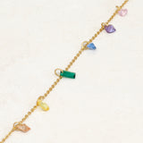 Rainbow pride bracelet featuring droplets with colours from the rainbow pride flag, straight line