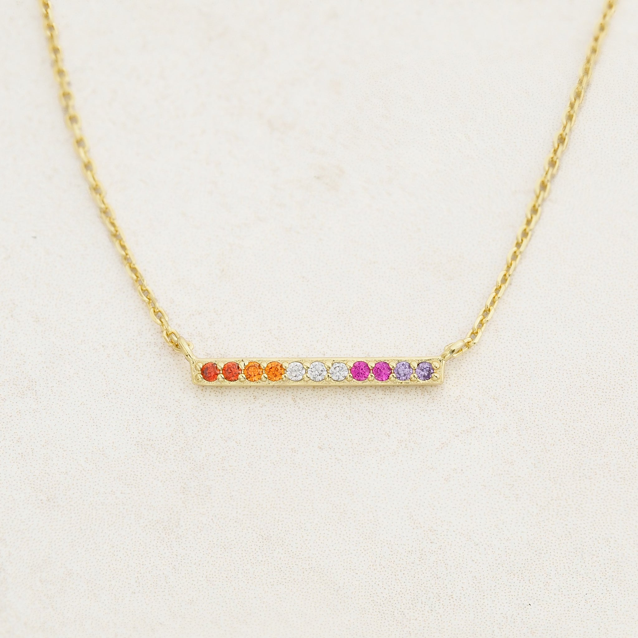 Lesbian line necklace featuring colours of the lesbian flag, front angle