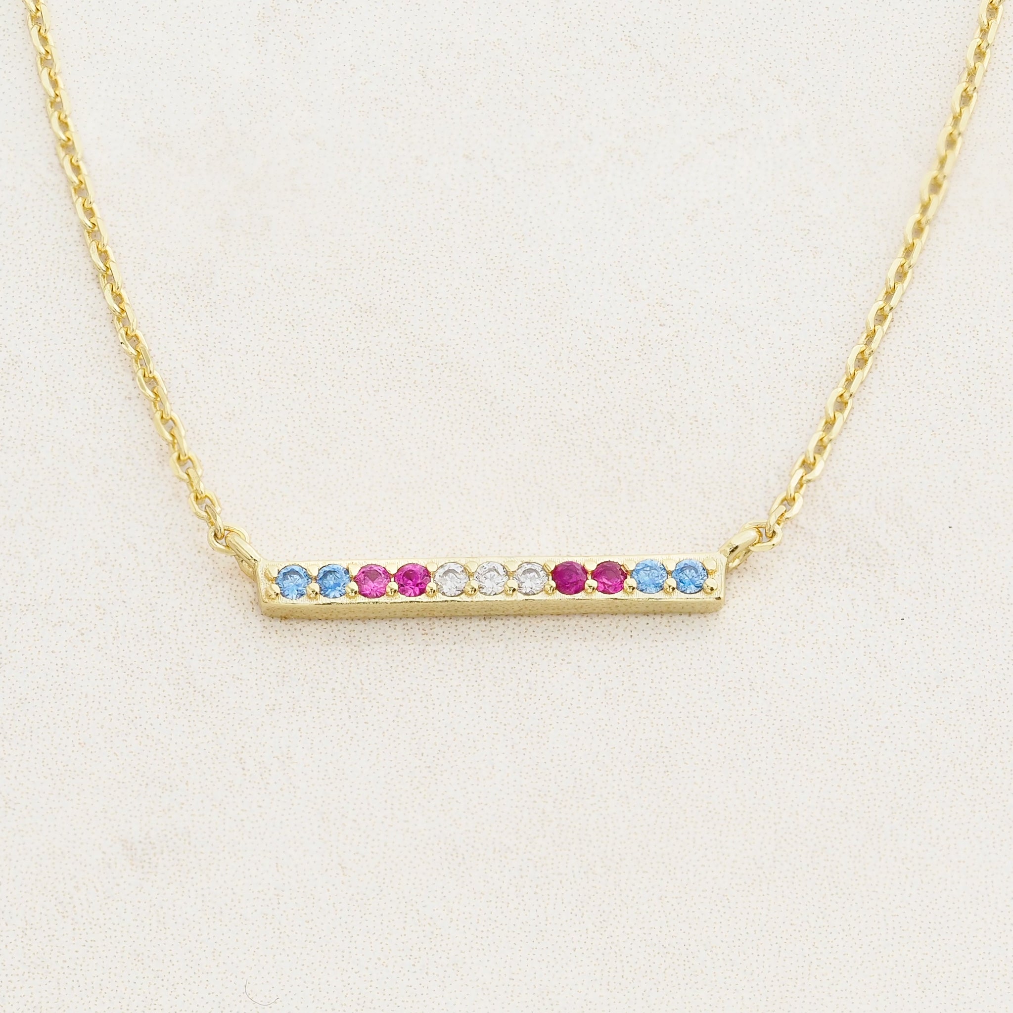 Transgender necklace, pride jewelry, featuring colours from the transgender flag, straight on