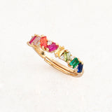 rainbow pride ring with collision design featuring stones with rainbow pride flag colours, 45 degree angle