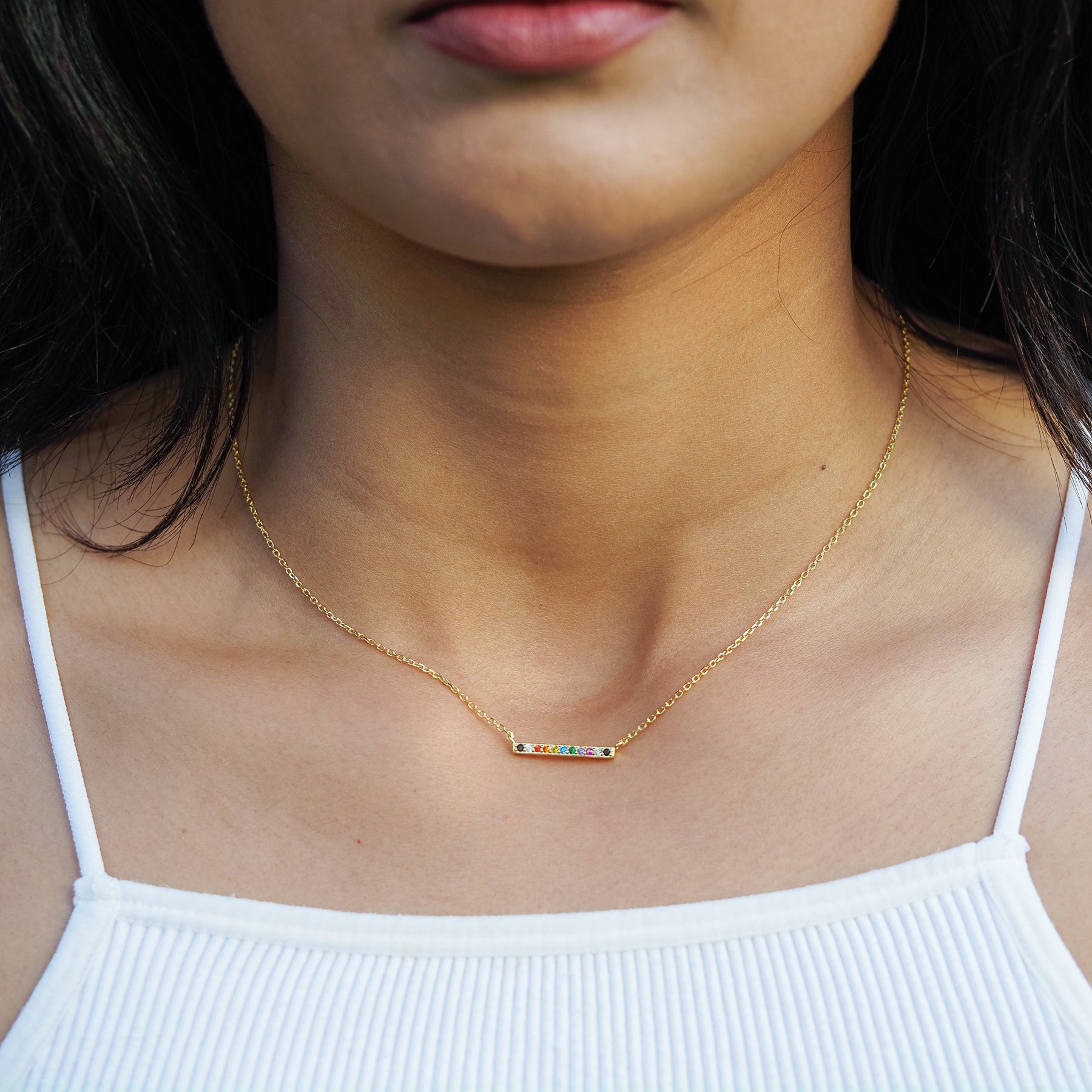 LGBT ally line necklace with LGBT ally flag design and colours another example of pride jewelry, model photo