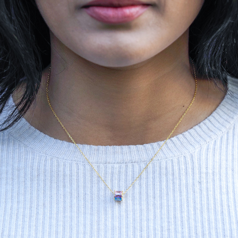 bisexual necklace in revolve style with the colours of the bisexual flag on model