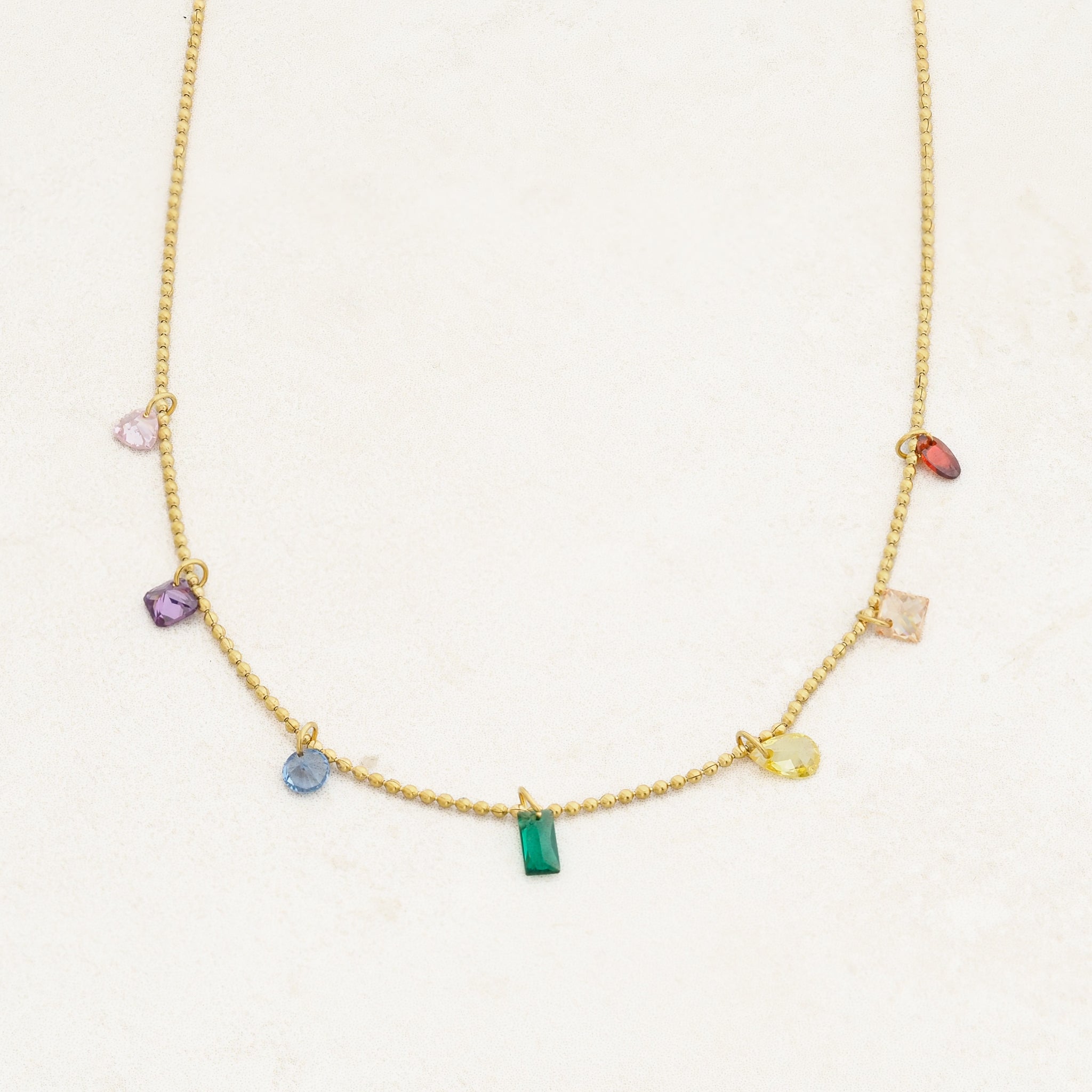 Rainbow pride necklace featuring droplets with colours from the rainbow pride flag, straight on