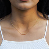 pansexual line necklace with pansexual flag design as part of the pride jewelry collections, model shot