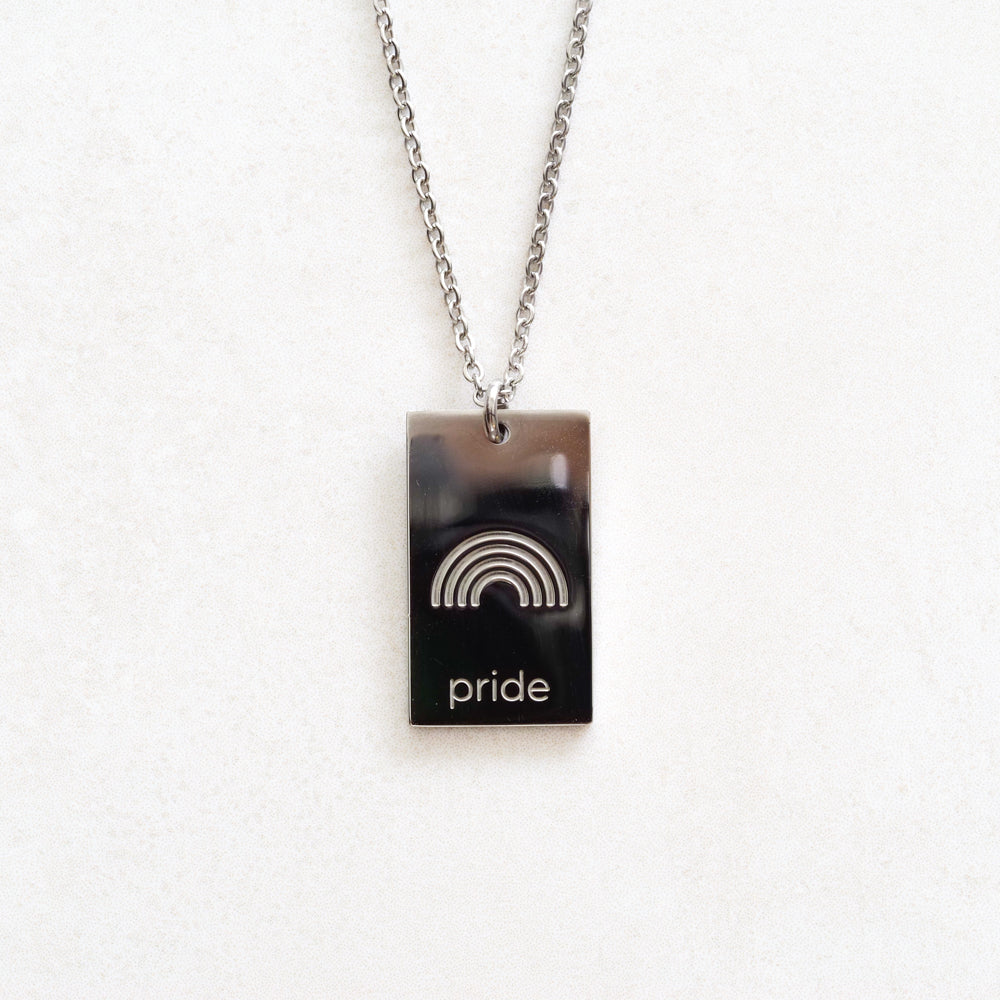 pride tag necklace with rainbow symbol and pride text in pride jewellery collection, silver close