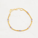 purple and gold bracelet, wear it purple day, pride jewelry, wide shot